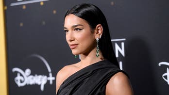 Pop star defends 2020 strip club visit with Lizzo