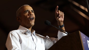 Obama heckled at Arizona rally while stumping for Democratic candidates