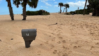 Florida beachfront homes covered in sand following Hurricane Nicole