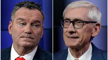 Wisconsin Gov. Tony Evers argues that democracy is on the ballot in bid for re-election