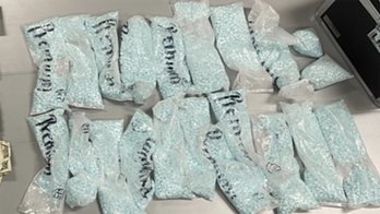 Texas man found clutching gun while asleep in running car with several thousand fentanyl pills: police