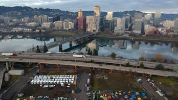 Portland perplexed by homeless cabins built along prime riverside real estate
