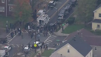 Two New Jersey police officers shot, officers search door-to-door for suspect