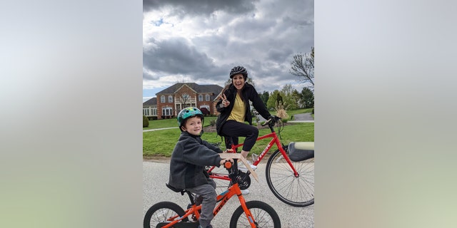 Jamie Hess goes on a bike ride with one of her sons.