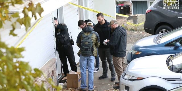 Investigators at the crime scene where four University of Idaho students were found fatally stabbed.