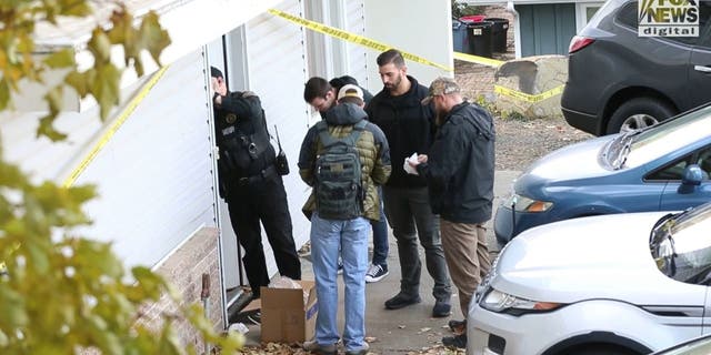 Investigators at the crime scene where four University of Idaho students were found fatally stabbed. 