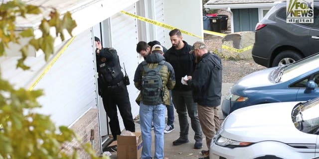 Investigators at the crime scene where four University of Idaho students were found fatally stabbed.