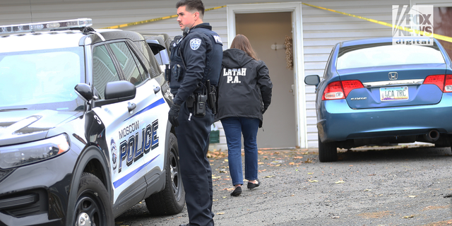 Police search a home in Moscow, Idaho on Monday, November 14, 2022, where four University of Idaho students were killed over the weekend in an apparent quadruple homicide.