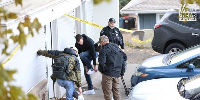 Investigators search the surroundings of the Moscow, Idaho, home where four students were murdered on November 13.
