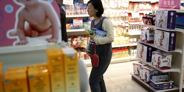 An expectant mother Li Zhao, 35, chooses baby products at a shop in Beijing Oct. 30, 2015. Li Zhao, an office worker who is six month pregnant, said one-child policy was cruel because having baby is basic civil right. However, she does not want to have second baby for her personal reason. China has unwound its one-child policy, for decades a symbol of invasive and coercive government planning, but the shift has been met with a disinterested shrug from many younger couples.