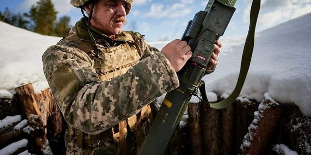 FILE PHOTO: A Ukrainian service member learns to use a M141 Bunker Defeat Munition weapon supplied by the United States at a training ground in the Lviv region, Ukraine.