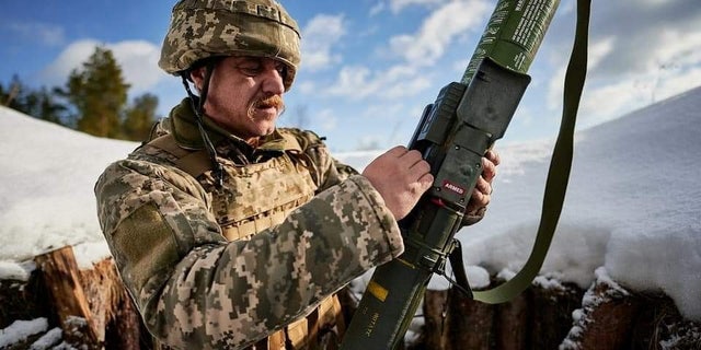 FILE PHOTO: A Ukrainian service member learns to use a US-supplied M141 Bunker Defeat Munition weapon at a training camp in the Lviv region of Ukraine.