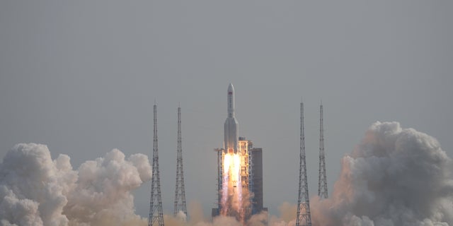 A Long March-5B Y4 rocket, carrying the Mengtian lab module for China's under-construction space station Tiangong, takes off from Wenchang Spacecraft Launch Site in Hainan province, China, on Monday.