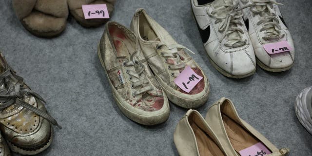 Shoes belonging to victims are arranged at a gym, where recovered belongings of the victims of a crowd crush that happened during Halloween festivities are kept, in Seoul, South Korea, Nov. 1, 2022. 