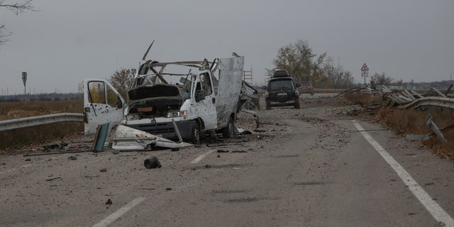 The wrecked car is seen on a highway to the city of Kherson during the Russian attack on Ukraine in the Kherson region of Ukraine on November 11, 2022.  