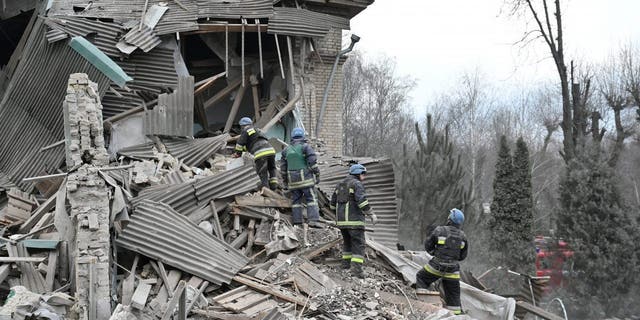 Rescuers work at the site of a maternity ward of a hospital destroyed by a Russian missile attack in Vilniansk, Zaporizhzhia region, Ukraine, Nov. 23, 2022. 