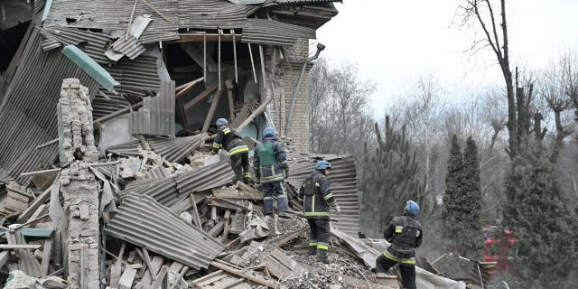 Rescuers work at the site of a maternity ward of a hospital destroyed by a Russian missile attack in Vilniansk, Zaporizhzhia region, Ukraine, Nov. 23, 2022.