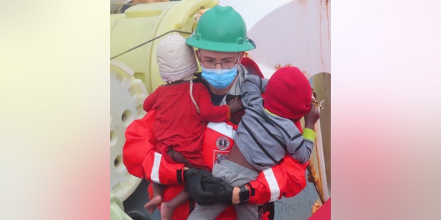 Children were among the 22 people rescued from the vessel. 