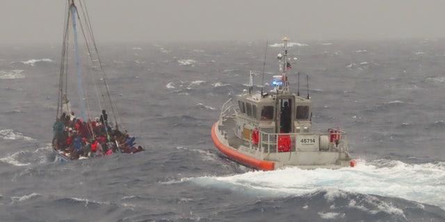It took several hours for the Coast Guard to rescue 22 migrants from the overloaded ship near the Florida Keys.
