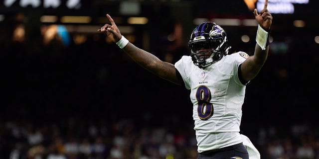 Lamar Jackson #8 of the Baltimore Ravens celebrates after a touchdown against the New Orleans Saints during the second half of the game at Caesars Superdome on November 7, 2022 in New Orleans, Louisiana.