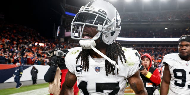 Davante Adams, #17 of the Las Vegas Raiders, celebrates after scoring a touchdown to win in overtime during an NFL game between the Las Vegas Raiders and Denver Broncos at Empower Field At Mile High on Nov. 20, 2022 in Denver.