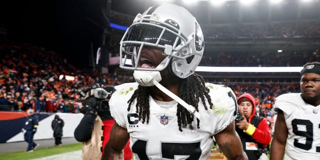 Davante Adams, #17 of the Las Vegas Raiders, celebrates after scoring a touchdown to win in overtime during an NFL game between the Las Vegas Raiders and Denver Broncos at Empower Field At Mile High on Nov. 20, 2022 in Denver.