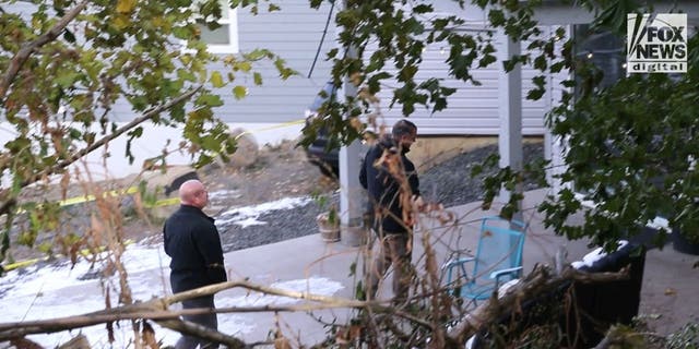 Investigators outside the home where four University of Idaho students were found fatally stabbed.