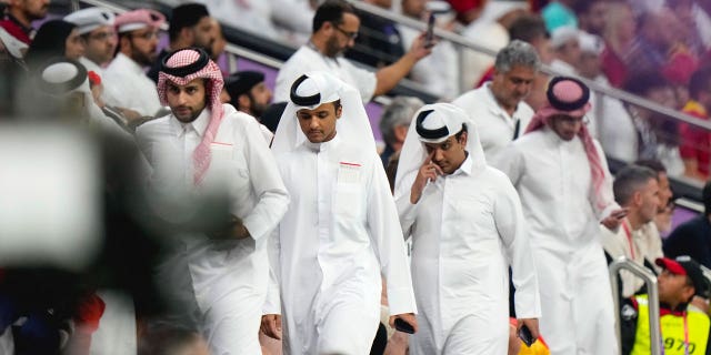 Men dressed in traditional Qatari thaubs during a match between Spain and Germany, at the Al Bayt Stadium in Al Khor, Qatar, on November 27, 2022.