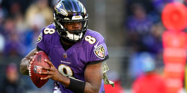 Lamar Jackson #8 of the Baltimore Ravens drops back to pass during the fourth quarter of an NFL football game against the Carolina Panthers at M&T Bank Stadium on November 20, 2022 in Baltimore, Maryland.