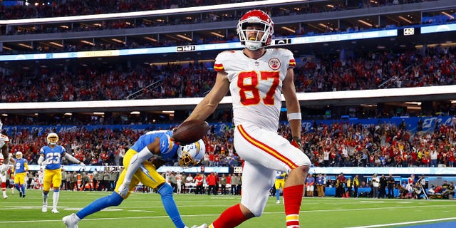 Travis Kelce of the Kansas City Chiefs scores a touchdown against the Los Angles Chargers at SoFi Stadium on Nov. 20, 2022, in Inglewood, California.