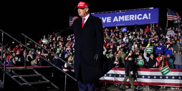 Former President Donald Trump greets supporters before speaking at a rally, Thursday, Nov. 3, 2022, in Sioux City, Iowa. (AP Photo/Charlie Neibergall)