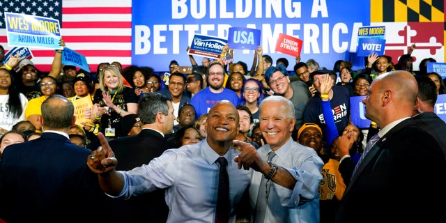 President Biden poses for photos with Maryland Democratic gubernatorial candidate Wes Moore during a campaign rally at Bowie State University in Bowie, Md., Monday, Nov. 7, 2022. 