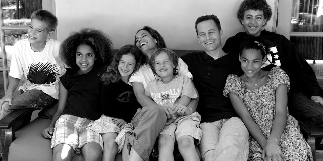 Writer and actor Kirk Cameron is pictured with his wife and their six children. Four of the couple's children are adopted.