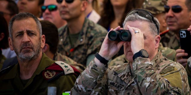 U.S. Chairman of the Joint Chiefs of Staff Mark Milley, right, and Israel's Chief of General Staff Aviv Kohavi watch a live-fire exercise at Tze'elim military base in Israel on Sept. 15, 2022.