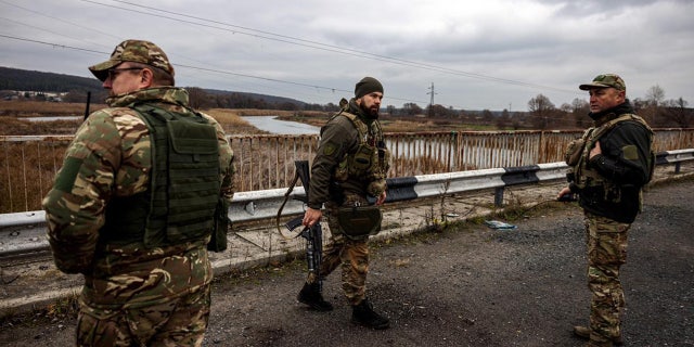 Commander Roman Hryshchenko, left, Commander of the 127th Detached Brigade of the Kharkiv Territorial Defense Forces.