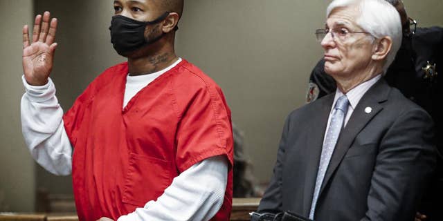 Hernandez Govan, left, the third suspect arrested in the murder of Memphis rapper Young Dolph, along with his lawyer William Massey, right, is arraigned in Judge Lee Coffee's courtroom on Thursday, Nov. 17, 2022.