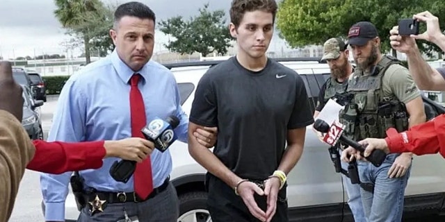 Austin Harrouff is transported by detectives to the Martin County Jail from St. Mary's Hospital in Stuart, Florida.