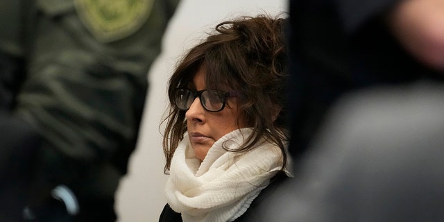 Denis Pesina, mother of Robert E. Crimo III, listening to Judge Victoria A. Rossetti during her son's second hearing in Lake County court Tuesday, Nov. 1, 2022. 