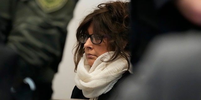 Denis Pesina, mother of Robert E. Crimo III, listening to Judge Victoria A. Rossetti during her son's second hearing in Lake County court Tuesday, Nov. 1, 2022.