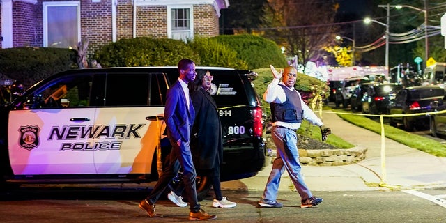 Newark Mayor Ras Baraka, right, arrives to the scene where two police officers were reported shot, Tuesday, Nov. 1, 2022, in Newark, New Jersey.