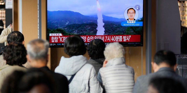 A television screen showing a news program reporting North Korea's missile launch with footage at the Seoul Railway Station in Seoul, South Korea Thursday, November.  3, 2022. 