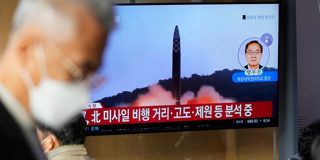 A TV screen showing a news program reporting on North Korea's missile launch with footage from the files is seen at a train station in Seoul, South Korea, Thursday, Nov. 3, 2022. 