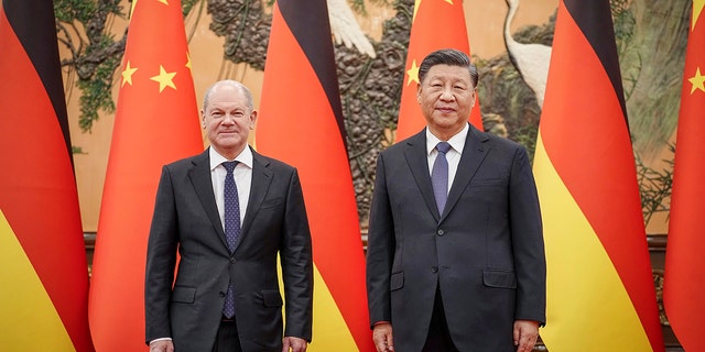German Chancellor Olaf Scholz, left, poses for a photo with Chinese President Xi Jinping in the Great Hall of the People in Beijing, China on Friday, November 4, 2022.