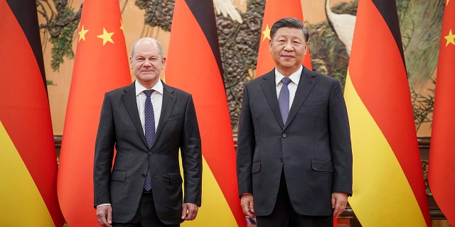 German Chancellor Olaf Scholz, left, poses for a photo with Chinese President Xi Jinping in the Great Hall of the People in Beijing, China on Friday, November 4, 2022.