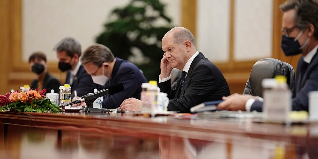 German Chancellor Olaf Scholz, second right, sits opposite Chinese President Xi Jinping, unseen, during their meeting in the Great Hall of the People on Friday, November 4, 2022 in Beijing.