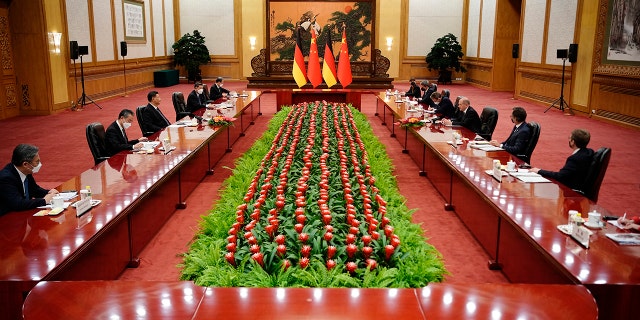 Chinese President Xi Jinping and German Chancellor Olaf Scholz attend a meeting in the Great Hall of the People, Friday, Nov. 4, 2022, in Beijing.
