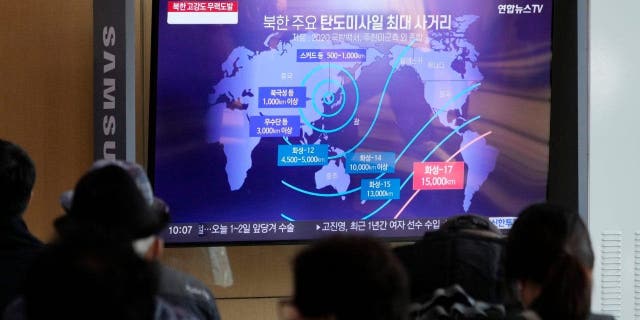 A TV screen showing a news program reporting on North Korea's missile launch at the Seoul Railway Station in Seoul, South Korea, Nov. 4, 2022. The sign reads "North Korea's main ballistic missile range."