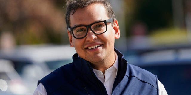 Republican candidate for New York's 3rd Congressional District George Santos campaigns outside a Stop and Shop store, Saturday, Nov. 5, 2022, in Glen Cove, New York.