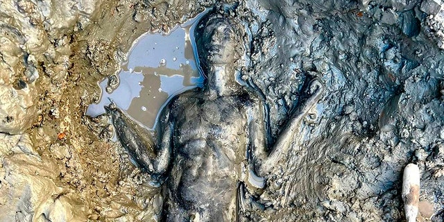 A statue is seen at the site of the discovery of two dozen well-preserved bronze statues from an ancient Tuscan thermal spring in San Casciano dei Bagni, central Italy, in this undated photo made available by the Italian Culture Ministry, Thursday, Nov. 3, 2022. 