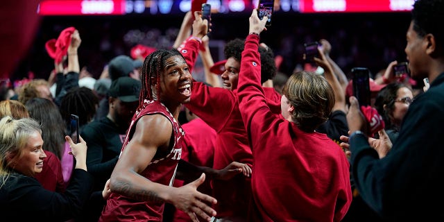Temple's Khalif Battle celebrates with fans after Temple won an NCAA college basketball game against Villanova, Friday, Nov. 11, 2022, in Philadelphia.